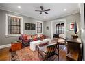 Stylishly decorated living room with warm lighting, rich textures, and hardwood floors at 93 Peachtree Ne Pl # 5, Atlanta, GA 30309