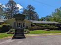 Exterior image features a covered entrance to the building and steps up to the door at 3941 Covered Bridge, Smyrna, GA 30082