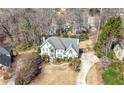 An aerial view of the traditional home showing the driveway and surrounding landscaping at 3819 Trotters Run, Douglasville, GA 30135