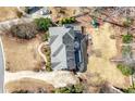 Overhead aerial view of the property showcasing the roof, deck, and surrounding yard at 3819 Trotters Run, Douglasville, GA 30135