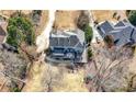 Birds eye view of the backyard of the house showing the deck and surrounding trees at 3819 Trotters Run, Douglasville, GA 30135