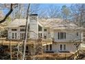 Spacious two-story home features a large wooden deck perfect for outdoor entertaining and relaxation at 3854 W Nancy Creek Ne Pl, Brookhaven, GA 30319