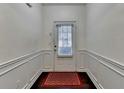 Bright entryway with decorative trim and a stylish welcome mat at 3981 Isaac Ct, Lilburn, GA 30047