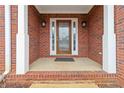 Welcoming front porch with classic brickwork and decorative columns, leading to a stylish front door at 51 Brookshire Ct, Dallas, GA 30157