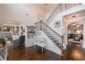 Elegant entryway with hardwood floors, a staircase with iron railings, and views into the living room at 58 Ashbury Cir, Dallas, GA 30157