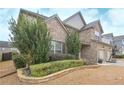 Charming two-story brick home featuring a well-manicured lawn and manicured landscaping at 58 Ashbury Cir, Dallas, GA 30157