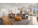 Inviting living room featuring natural light, modern furnishings, and hardwood flooring at 665 Lake Charles Way, Roswell, GA 30075