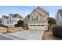 Lovely two-story home with a two-car garage, brick accents, and manicured lawn in a desirable suburban neighborhood at 2025 Drogheda Ln, Marietta, GA 30066