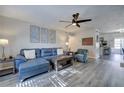 Comfortable living room with a sectional sofa, accent chair, and easy access to the kitchen at 6700 Roswell Rd # 32C, Atlanta, GA 30328