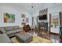 Inviting living room with a decorative fireplace, comfortable seating, and a bright and airy atmosphere at 2295 Hemrick Rd, Cumming, GA 30041