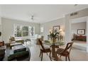 Living room and dining area featuring neutral tones, a ceiling fan, and a clear view from the window at 2310 River Green Nw Dr, Atlanta, GA 30327