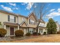 Attractive townhome featuring covered porch, neutral siding, stone accents, and mature landscaping at 3541 Parc Sw Cir, Atlanta, GA 30311