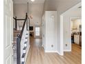 Open entryway with hardwood floors and staircase leading to the upper level at 4710 Vineyard Se Ct, Smyrna, GA 30082