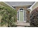 Close-up of front door with stone accent wall and green door at 4710 Vineyard Se Ct, Smyrna, GA 30082