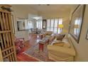 Inviting living room with hardwood floors, plantation shutters, and open access to the dining area at 3777 Peachtree Ne Rd # 733, Atlanta, GA 30319