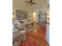 Charming living room with hardwood floors, ample seating, and stylish decor creating a comfortable and inviting atmosphere at 3777 Peachtree Ne Rd # 733, Atlanta, GA 30319