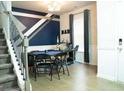 Entertainment space features stairs, a bar area, pool table, and unique wall art at 824 Drumore Ct, Fairburn, GA 30213