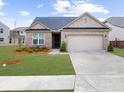 Charming single-story brick home with a well-maintained lawn and attached two-car garage at 6451 Crest Brook Way, Buford, GA 30518