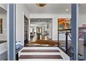Elegant foyer with hardwood floors and an open layout that showcases the home's inviting and spacious atmosphere at 620 Camp Ave, Roswell, GA 30075