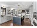 Spacious kitchen with a large center island, granite countertops, and modern stainless steel appliances at 620 Camp Ave, Roswell, GA 30075