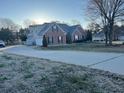 Exterior view of brick home with attached garage and long driveway at 1507 Smithfield Dr, Mcdonough, GA 30252