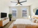 Comfortable bedroom with neutral walls, plush bedding, and natural light from two windows at 2693 Avanti Way, Decatur, GA 30035