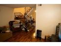 Inviting living room features hardwood floors and stairs leading to the upper level at 2726 Evans Mill Dr, Lithonia, GA 30058