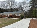 View of the home with newly poured concrete driveway at 5862 Kitchens Se Rd, Mableton, GA 30126