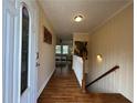 Inviting foyer featuring hardwood floors and staircase at 5862 Kitchens Se Rd, Mableton, GA 30126