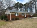 A well-kept ranch-style house with a brick front and tasteful landscaping details at 5862 Kitchens Se Rd, Mableton, GA 30126