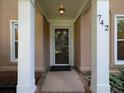 Elegant front door with classic architectural details and sidelights, creating a welcoming entrance at 742 Olde Towne Ln, Marietta, GA 30068