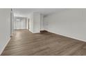 Living room boasts wood floors, neutral walls, and access to a sliding glass door that leads to a patio at 3183 Abbeywood Dr, Decatur, GA 30034