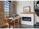 Dining area with fireplace and large window at 5434 Peachtree Rd # 115, Chamblee, GA 30341