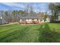 Spacious backyard with a wooden deck, perfect for outdoor entertaining and relaxation at 921 Forest Park Ln, Suwanee, GA 30024