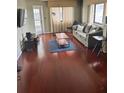 Open-concept living area features wood floors and natural light at 795 Hammond Dr # 1712, Atlanta, GA 30328