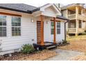 Charming home featuring a modern front door with glass panels and bright, fresh paint at 1466 Venetian Sw Dr, Atlanta, GA 30311