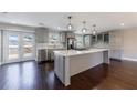 Modern kitchen with stainless steel appliances, a center island, and access to the outdoor deck at 3044 Windfield Cir, Tucker, GA 30084