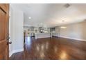 Open floor plan showcasing hardwood floors, a modern kitchen, and lots of natural light at 3044 Windfield Cir, Tucker, GA 30084