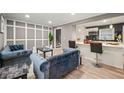 Open living space with modern grey paint, white trim, and a view of the breakfast bar at 3648 Garrison Sw Dr, Atlanta, GA 30331