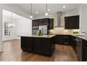 Kitchen with granite countertops, stainless steel appliances and dark wood cabinets at 145 Rose Garden Ln, Alpharetta, GA 30009