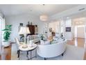 Bright and airy living room with hardwood floors, a neutral palette, and comfortable seating with lots of natural light at 3101 Howell Mill Nw Rd # 327, Atlanta, GA 30327