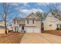 Charming home with a two-car garage, inviting front porch, and well-maintained landscaping at 6557 Snow Bird Ln, Douglasville, GA 30134