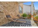 Cozy front porch featuring stylish outdoor seating and a welcoming entrance to the home at 2713 Serena Way, South Fulton, GA 30331