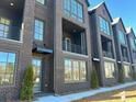 Modern townhome featuring beautiful brickwork, stylish windows, and inviting balconies at 2637 Mackintosh Ct # 8, Brookhaven, GA 30319