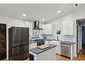 Updated kitchen featuring stainless appliances, white cabinets, dark countertops, and a stylish island at 3180 Vine Cir, Decatur, GA 30033