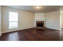 Bright living room with fireplace and beautiful hardwood floors at 8542 Lakemeadow Dr, Union City, GA 30291