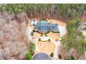 Expansive property features a pool, basketball court, and lush greenery at 3201 Hobsons Ridge Nw Trl, Acworth, GA 30101