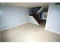 Spacious living room with tile flooring and staircase leading to the upper level at 2660 Evans Mill Dr, Lithonia, GA 30058