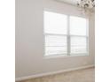 Bright bedroom featuring plush carpeting, neutral walls, and a large window at 4924 Rapahoe Trl, Atlanta, GA 30349