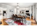 Spacious dining area featuring hardwood floors and seamlessly flows into the living room at 1255 Wildcliff Ne Pkwy, Atlanta, GA 30329